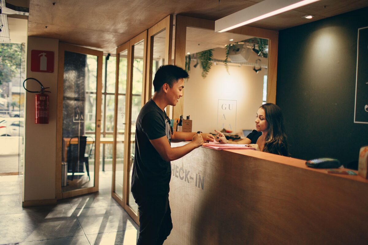 Traveler checking in at a hotel front desk